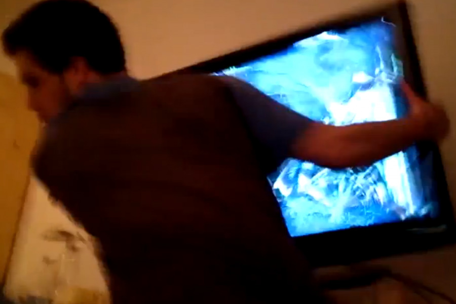 Angry Gamer smashing TV 